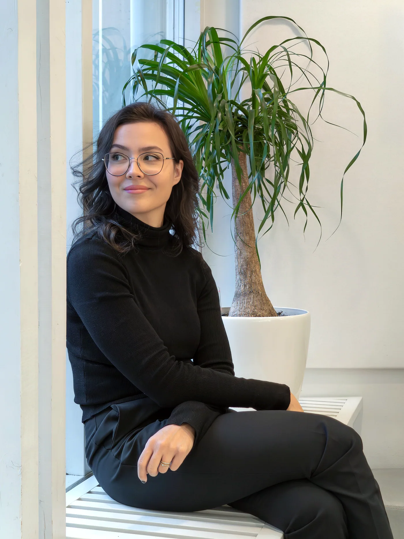 Jenni Lintumäki sitting by a window